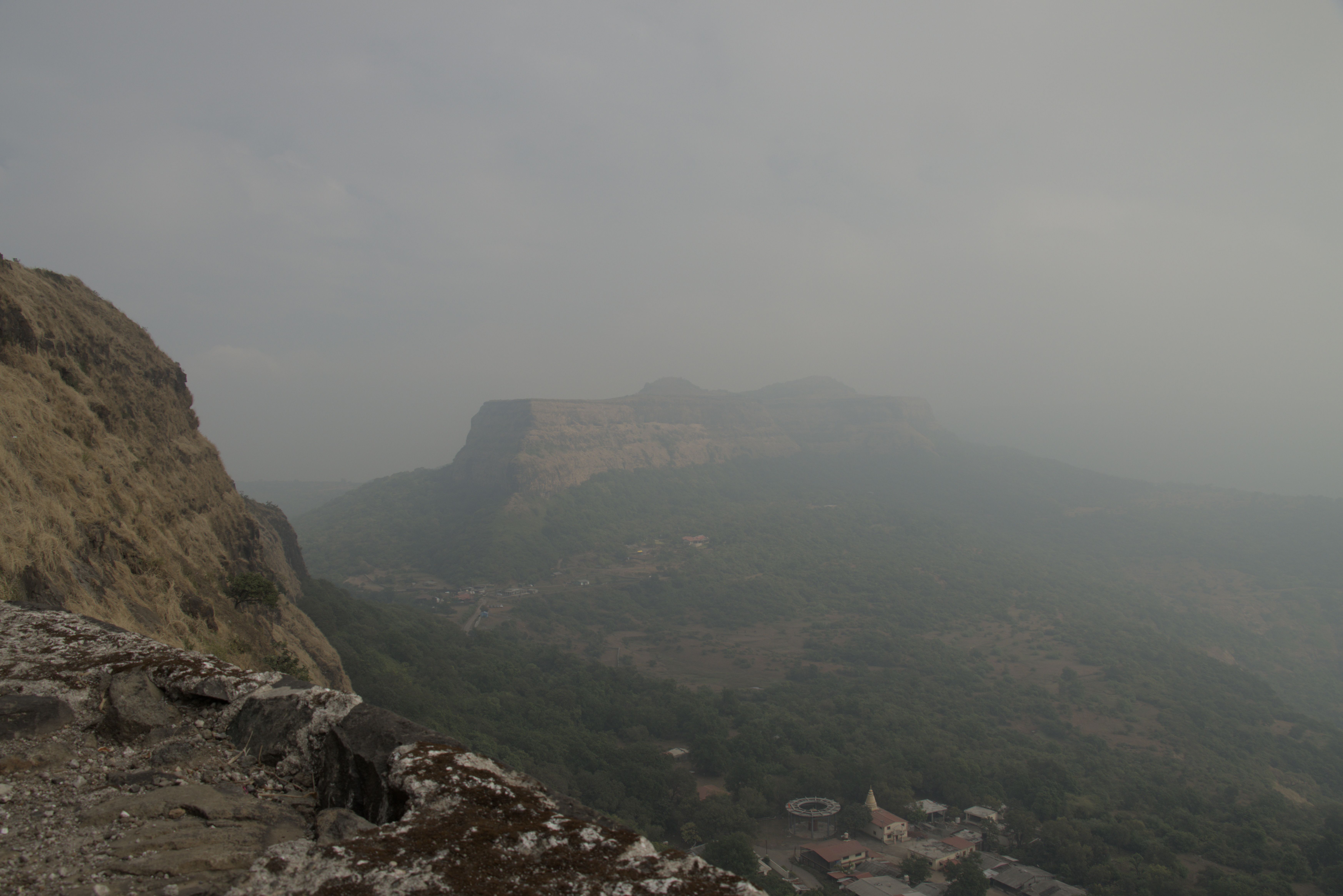 Looking down into village around hike entrance and out to Visapur Fort.