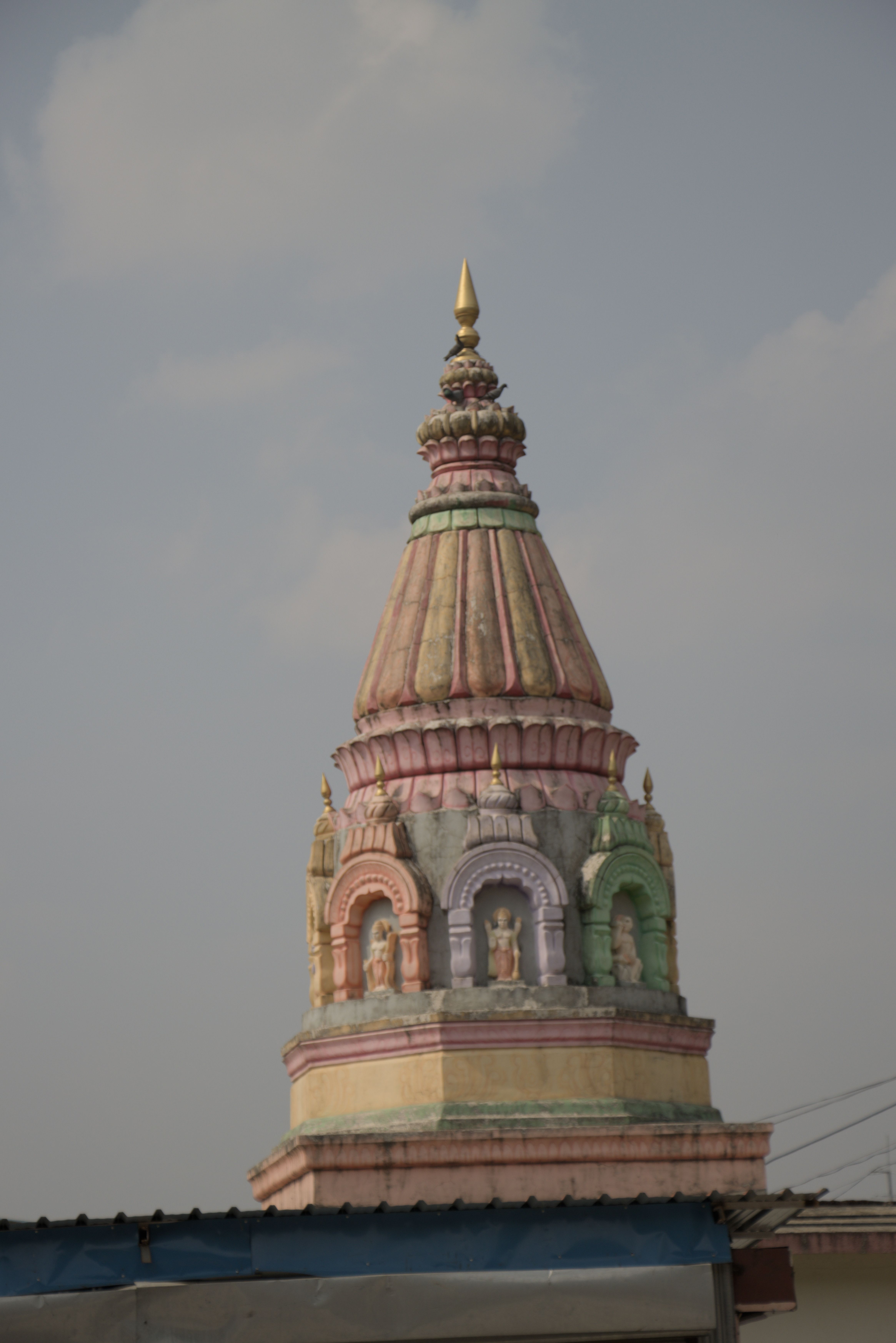 Colorful temple spire near Lohagad Fort and Bhaja Caves